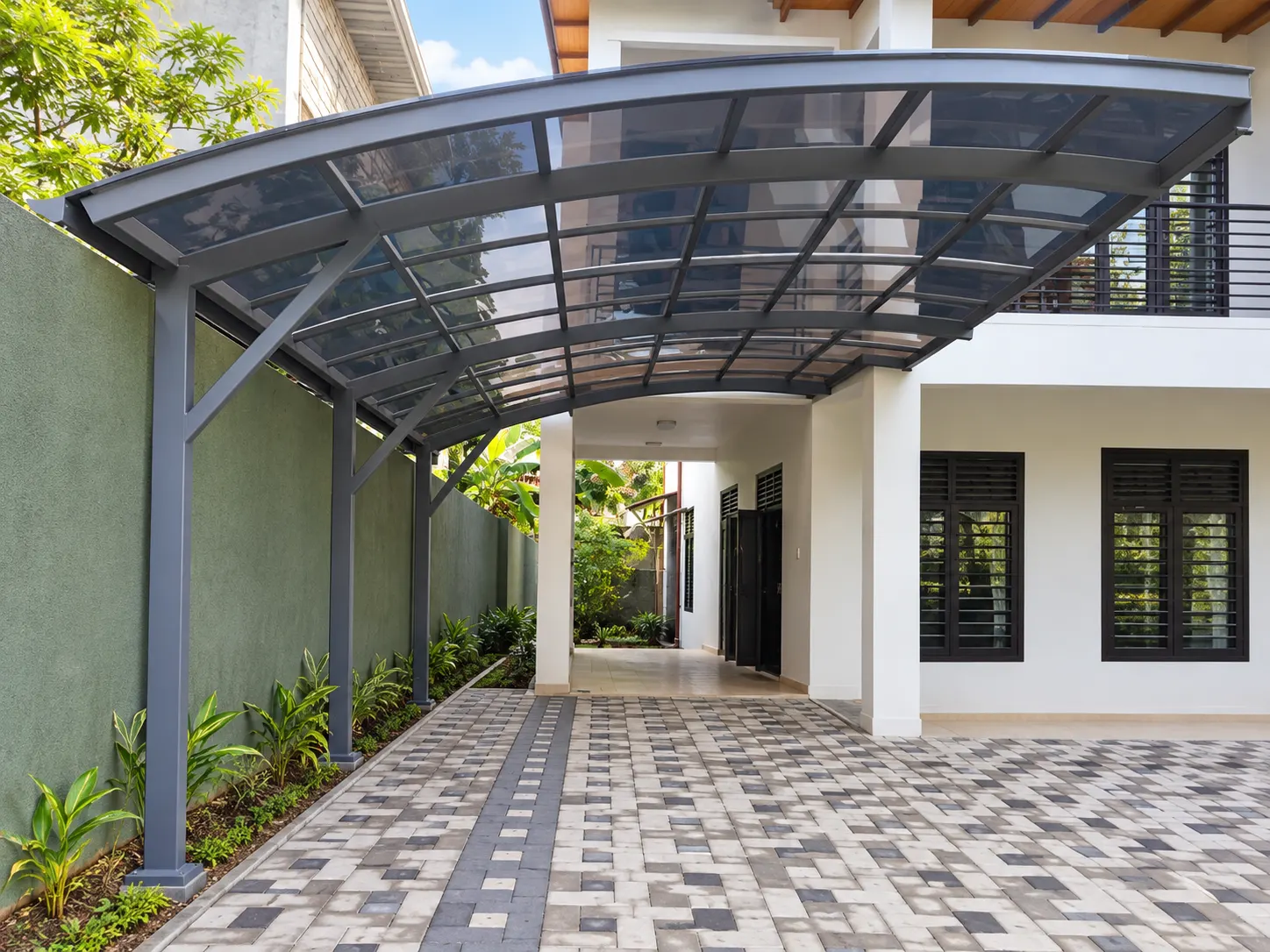 Curved carport over a driveway entrance