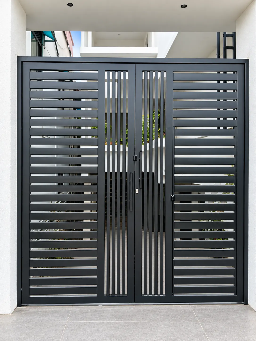 Modern black steel driveway gate