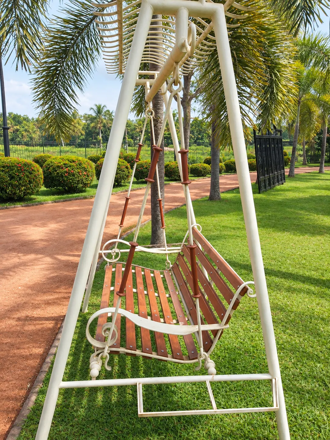 Ornate garden swing, front view